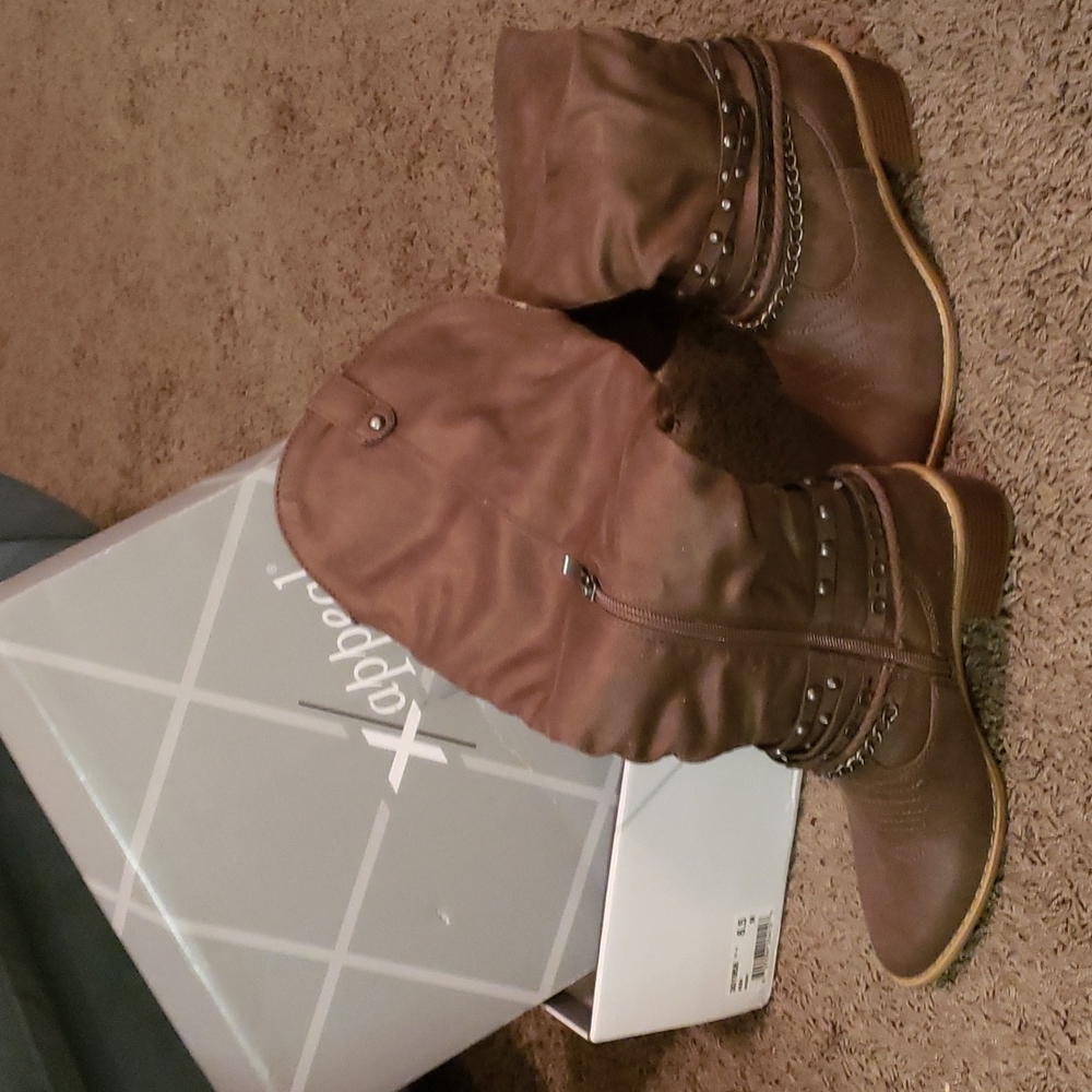 Tall brown xapped boots purchased from DSW.